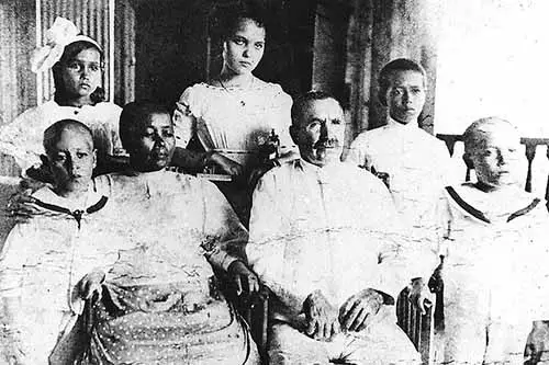Ignacia Butler, back row center, poses with her family in 1912. Her father, Baltazar Bordallo, was from Saucelle, Spain. Her mother, Rita Borja Pangelinan, was from Hågat, Guam. The children, from left, Baltazar Jerome ("BJ"), Delfina, Ignacia, Carlos, and Tomas. Corrections provided by Donna Champion from Clara Mae Champion. Jacqui Champion-McMahon photo.