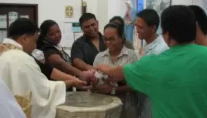 Baotismo of Royce Surigao, 2008. He is held by his parents, Joelyn Sanchez and Roy Surigao, and his four godparents. Godparents are chosen from family or close friends. Surigao family collection.