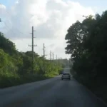 Route 15, commonly referred to as the "Backroad" provided an undisturbed link from Mangilao to the back gate of Andersen Air Force Base in Yigo. Several houses have sprung up along this once sparsely populated road