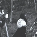Men and women gather to honor family members lost in the massacres. Micronesian Area Research Center (MARC) collection.