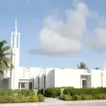 The first Mormons on Guam, in 1950, were in the military. They began meeting in rented space and an old navy chapel of quonset huts until they built a church in Barrigada. Sheila Tyquiengco photo for Guampedia.