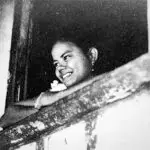 A young unmarried women, sottera, was often restricted to the house in Pre-WWII Guam. Photo from the National Geographic courtesy of Don Farrell.
