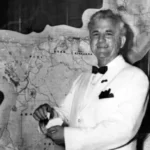 Governor Bill Daniel, 1961 – 1963, standing in front of map of Guam. Guam Police Official Photograph and courtesy of the Micronesia Area Research Center.