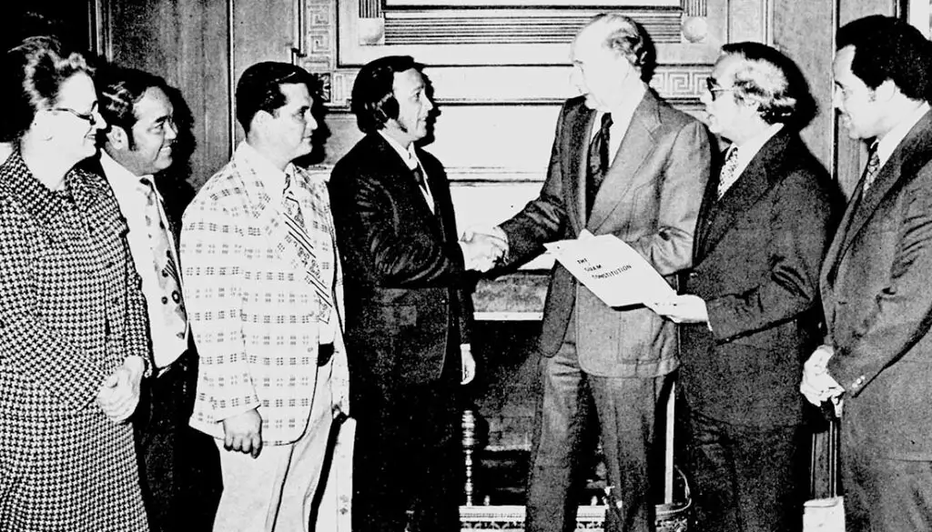 Guam leaders meet with US Senator Spark M. Matsunaga after the US Senate hearing on the proposed Guam Constitution. L to R: Sen. Antonio M. Palomo, Con-Con Delegate Judith P. Guthertz, Con-Con President Carl Gutierrez, Mr. Walter Ferenz, representing the Guam Bar Association, Mr. Greg S. Perez, Chamber of Commerce president. Guam's Congressman Antonio B. Won Pat, and Sen. Matsungaga who chaired the hearings. Photo courtesy of the Micronesian Area Research Center (MARC).