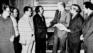 Guam leaders meet with US Senator Spark M. Matsunaga after the US Senate hearing on the proposed Guam Constitution. L to R: Sen. Antonio M. Palomo, Con-Con Delegate Judith P. Guthertz, Con-Con President Carl Gutierrez, Mr. Walter Ferenz, representing the Guam Bar Association, Mr. Greg S. Perez, Chamber of Commerce president. Guam's Congressman Antonio B. Won Pat, and Sen. Matsungaga who chaired the hearings. Photo courtesy of the Micronesian Area Research Center (MARC).