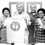 Governor Ricardo Bordallo proudly receives a t-shirt from the Chamorro (CHamoru) Language Commission.