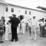 The Pan American flight crew are greeted at the Pan American Hotel by military personnel, 1935. R.O.D. Sullivan/Pan American Historical Foundation