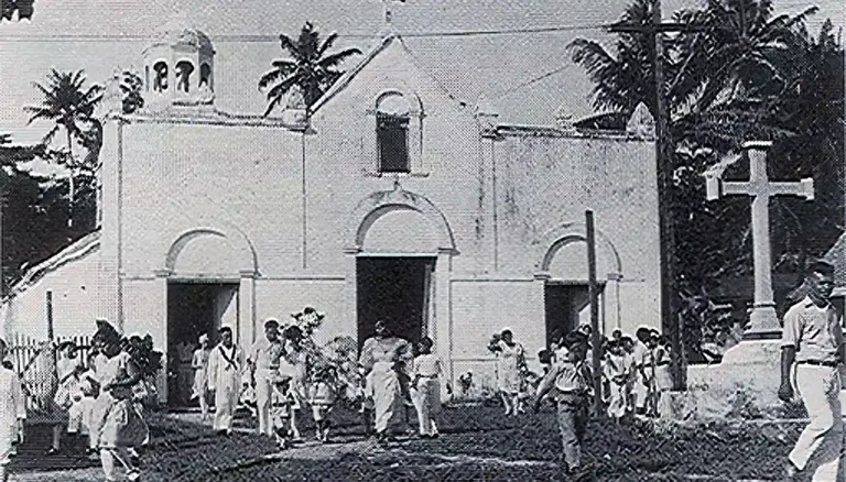 The cross seen at the far right still stands at the site of the former Santa Guadalupe Church site in Sumay. Photo courtesy of Don Farrell.