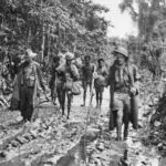 Porters on Muddy Track, Buna