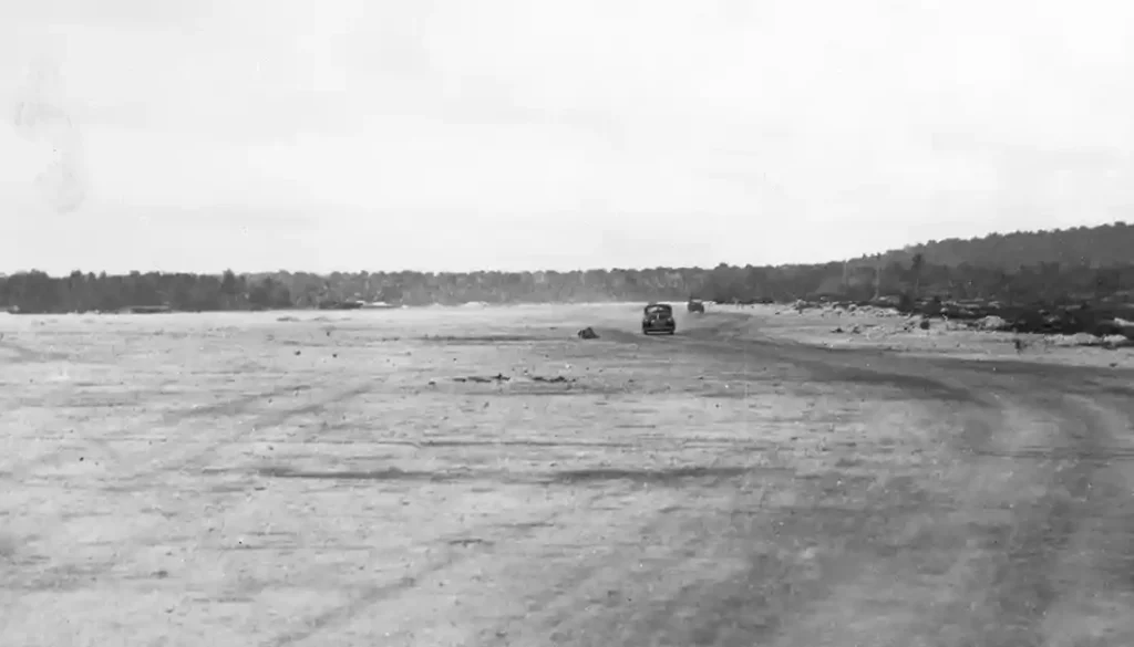 August 12, 1944. Airstrip (Tiyan) built by the Japanese about three miles northwest of Hagåtña/Agana. USS Indianapolis (CA 35). National Archives 80-G-248089