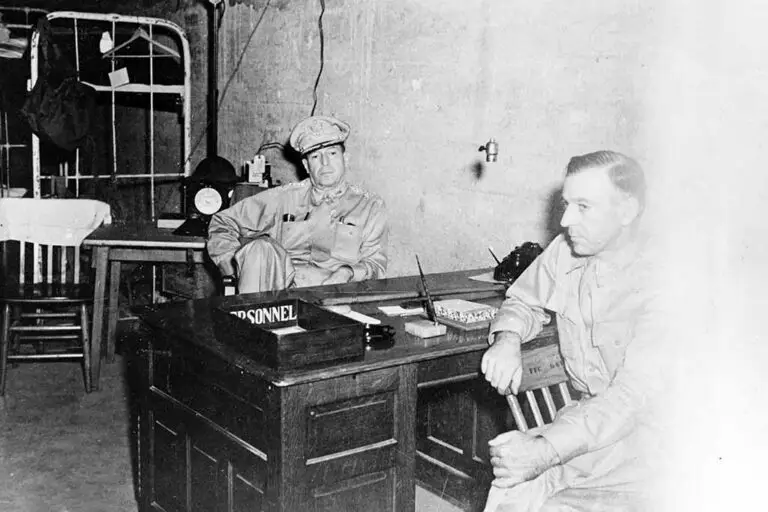 MacArthur and Sutherland in HQ tunnel, Philippines. SC 265357