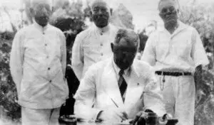 Naval Governor Willis Bradley signs the Bill of Rights, 1933. Photo courtesy of the Department of Chamorro Affairs from the Nieves Flores Memorial Library.