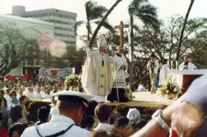 Pope John Paul II wave from stage, temporary altar, in the Skinner Plaza/Plaza de Espana area, 1981. Skinner and Plaza de Espana area where statue is now (2017).