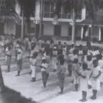 Schoolchildren lined up for a fingernail and cleanliness inspection
