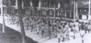Schoolchildren lined up for a fingernail and cleanliness inspection